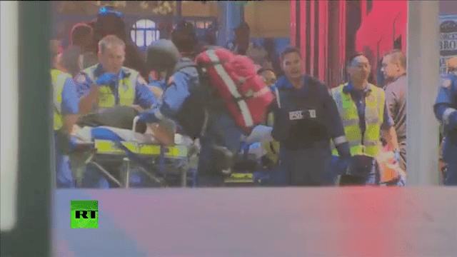 The Strange CPR performed by Special Operations Police Officer while paramedics wheel the trolley.