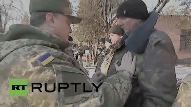 When all else fails... Poroshenko pins the Medal of Ukraine on the chest of the Ukraine Commander in Debaltseve. 