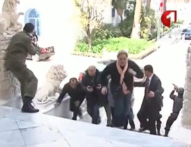 Civilians Scramble to safety in Tunis, March 18th, 2015.