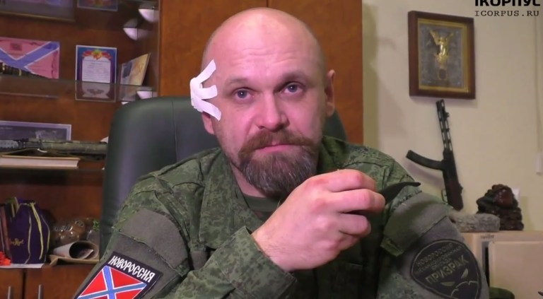Alexei Mozgovoi, appears soon after ecent failed attempt on his life, hence the bandage on his ear, now they succeeded.