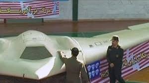 Iranian Miltary Officials show off the captured RQ 170. drone.