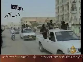 The Islamic State of Iraq celebrate their inception by driving through Central ramadi in late 2006