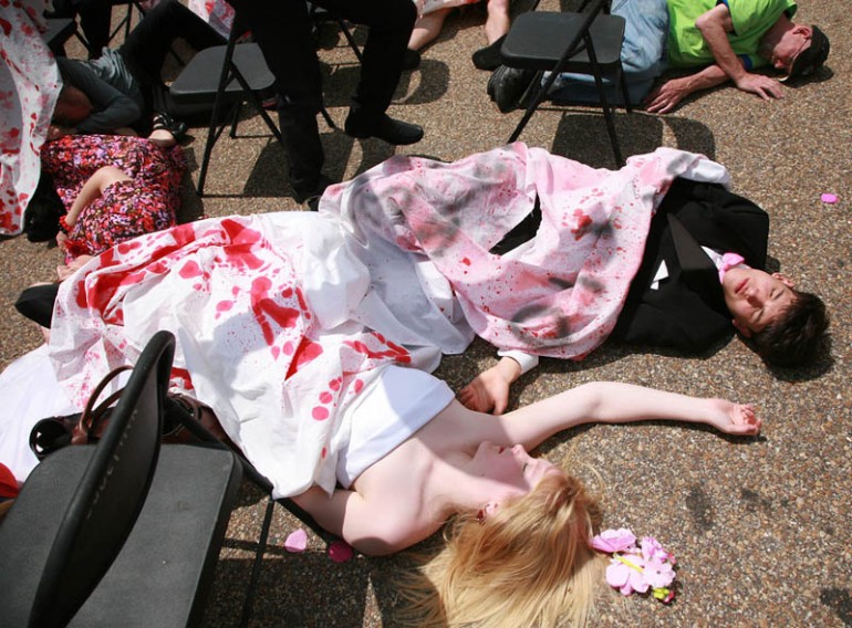 Code Pink activists re enact an earlier US massacre of a Yemeni wedding party.