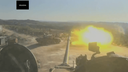 Russian operated tank fires into the Latakia hills.