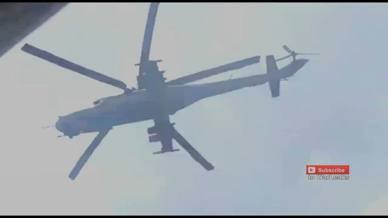 Amazing rebel footage shows the MI24 helicopter flying extremely low under heavy machine gun fire. 