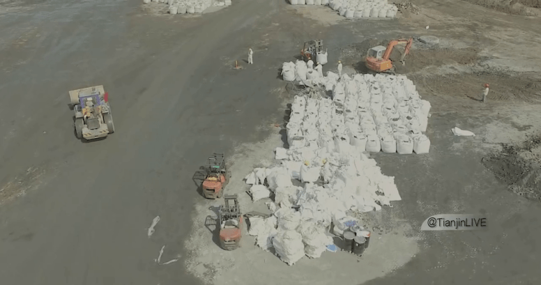 The white bags are where the soil that is being removed is placed.