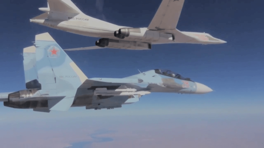 Su30 fighter escorts TU 160long range bomber. 