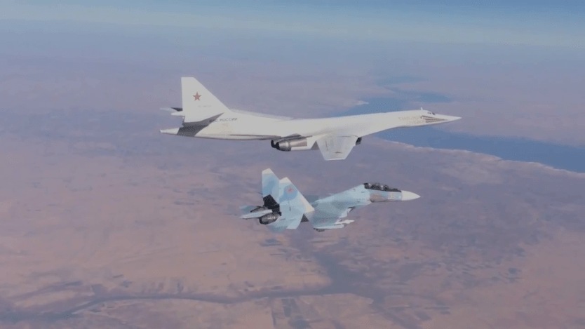 Su30 fighter escorts TU 160long range bomber. 