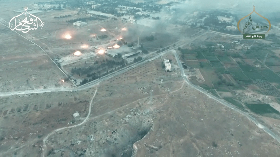 MLRS shells and airstrikes rain down on the over run Aleppo Artillery Academy. 