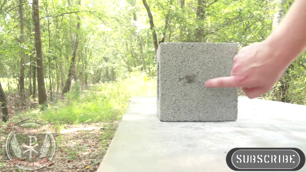 A concrete block after a standard steel jacketed bullet from a 9mm, pistol has been fired into it. 