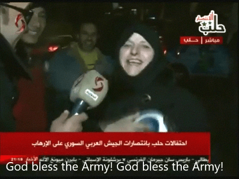 Syrians celebrate the end of the battle of Aleppo in the city on the night of Monday December 12th, 2016.